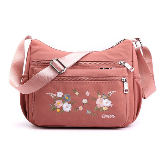 Schultertasche mit Blumenstickerei
