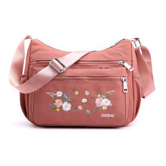 Schultertasche mit Blumenstickerei