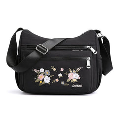 Schultertasche mit Blumenstickerei