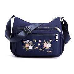 Schultertasche mit Blumenstickerei