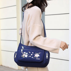 Schultertasche mit Blumenstickerei