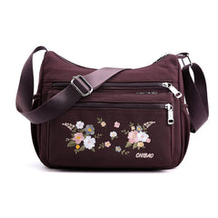 Schultertasche mit Blumenstickerei